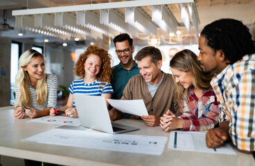 Group of business people and software developers working as a team in office