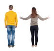© ghoststone - Back view of couple in sweater showing thumbs up.