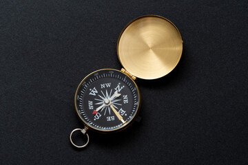 navigation equipment for orienteering. compass on the the black background.