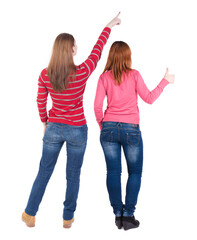 Wall Mural - Back view of two pointing girl in sweater.