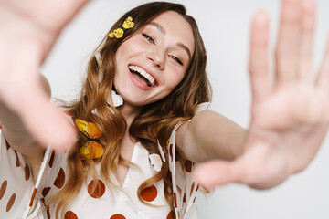 Canvas Print - Photo of cheerful woman with fake butterflies laughing at camera