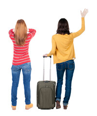 Poster - Back view of two woman in sweater traveling with suitcas.