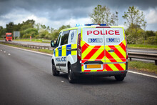 Police Car Siren Flashing Blue Lights On Motorway
