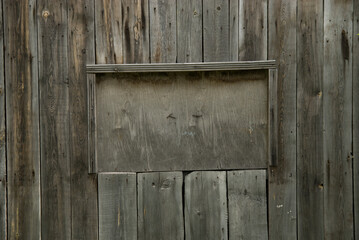 Wall Mural - Wooden old grey background with a niche for the inscription.