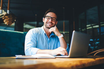 Concentrated experienced financial manager checking budget accountings working on report