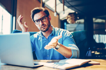 Portrait of cheerful businessman completing work on startup satisfied with making great job