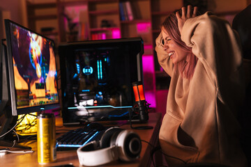 Poster - Image of displeased girl grabbing her head while playing video game