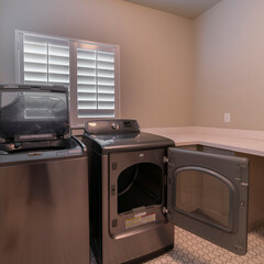 Wall Mural - Square crop Electrical appliances in a laundry room interior