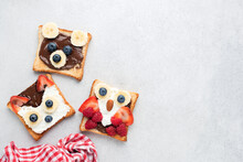 Funny Healthy Breakfast Toasts For Kids Shaped As Cute Animals On Grey Concrete Background With Copy Space For Text. Children's Food Menu For School Lunch Box Or Breakfast At Home. Motherhood Concept