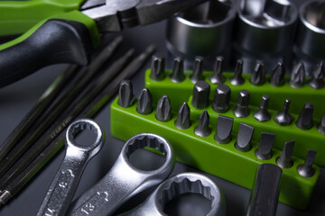 Wall Mural - A set of building tools and instruments for repair in black and green colour. Must-have for men. Equipment for building. Repair tool kit. construction concept. gray background . High quality photo