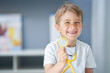 © Kalim - A little doctor with stethoscope smiling in doctor's office