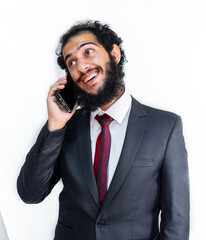 Wall Mural - Muslim man wearing tuxedo and talking on the phone