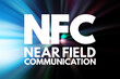 © dizain - NFC - Near Field Communication acronym, technology concept background