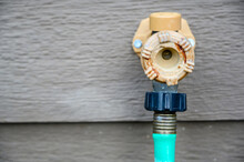 Handle-Operated Freezeless Residential Wall Hydrant Mounted On Exterior Of House