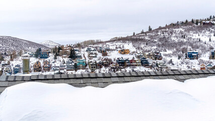 Canvas Print - Panorama Gray snowy roof against colorful homes on frosted hill in Park City Utah