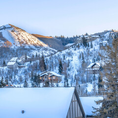 Canvas Print - Square Snowed in mountain in Park City during winter with homes under overcast sky