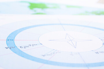 Wall Mural - The desktop of an astrologer. The magical mysterious atmosphere of the working environment of the predictor of the future. Printouts of astrological charts and tables scattered across the table.