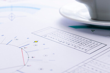 Wall Mural - The desktop of an astrologer. The magical mysterious atmosphere of the working environment of the predictor of the future. Printouts of astrological charts and tables scattered across the table.