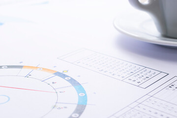 Wall Mural - The desktop of an astrologer. The magical mysterious atmosphere of the working environment of the predictor of the future. Printouts of astrological charts and tables scattered across the table.