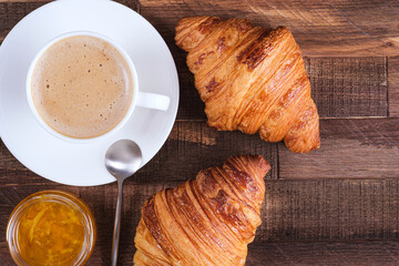 Cap coffee cappuccino and two croissant with jam