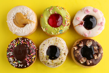  donut decorated with colorful sprinkles isolated on white background. Flat lay. Top view