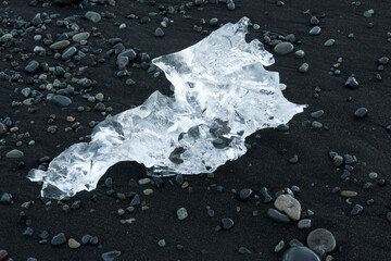 Wall Mural - small pieces of ice at volcano black beach iceland