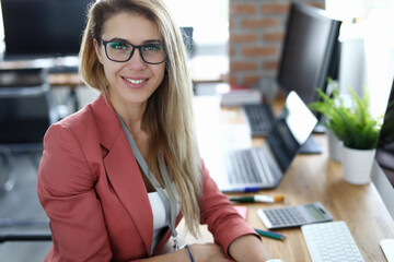 Business woman against modern office background portrait. Business education concept