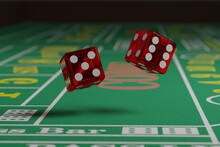 Close Up Of Dice Rolling On A Craps Table. Random Concept.