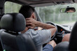 © velimir - male driver  massages the neck, back and neck pain.