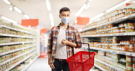 Sticker - Guy in a supermarket with a protective face mask and a shopping basket