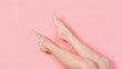 © Karyna - Female shaved legs against pink colored background. Removal hair. Minimalism. Top view. Body hygiene, spa procedures banner. Smooth skin