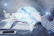 © peshkova - Double exposure of man's hand holding and using a digital device and brain hologram drawing. Data concept.