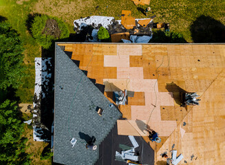 Wall Mural - Home with roof replacing new shingles, felt paper, and tools