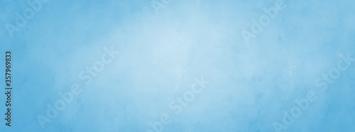 Cuadros en Lienzo Pastel blue background with soft blurred white center and faded old vintage text