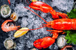 © wiratgasem - Shellfish and crustacean seafood with selection of fresh lobster, shrimp, fish, oyster, squid and crab on dark rustic background.