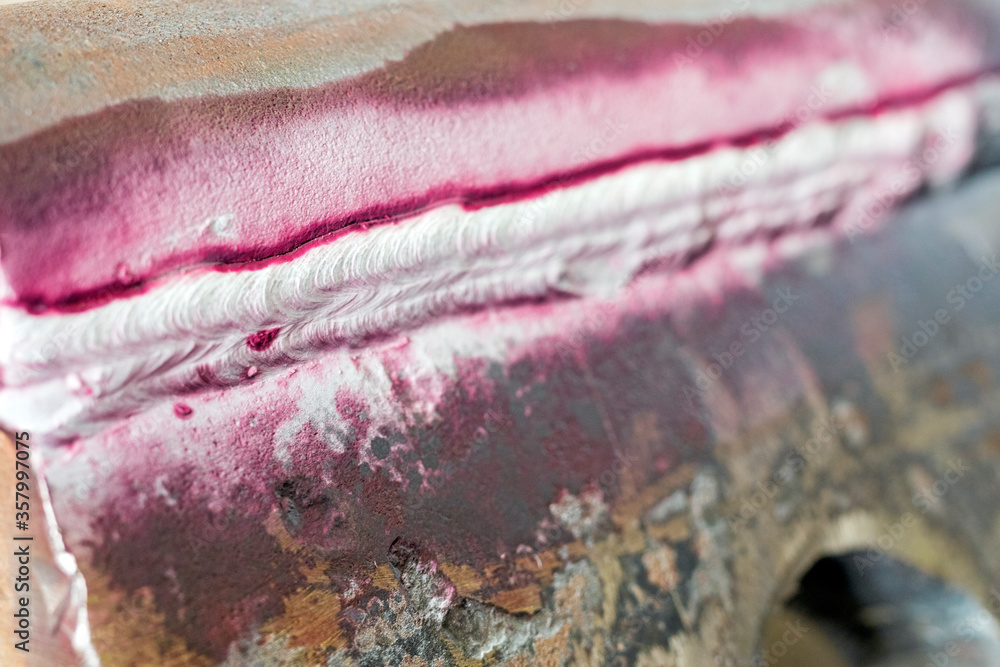 View of the longitudinal crack in the heat affected zone (top welding ...