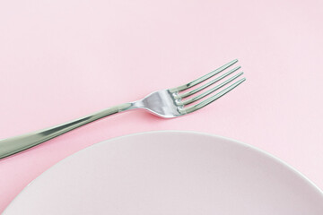 Wall Mural - Empty plate and cutlery as mockup set on pink background, top tableware for chef table decor and menu branding design