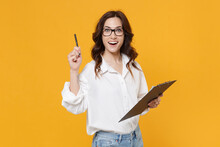 Excited Young Business Woman In White Shirt Glasses Isolated On Yellow Background. Achievement Career Wealth Business Concept. Hold Clipboard With Papers Document, Pointing Pen Up With Great New Idea.