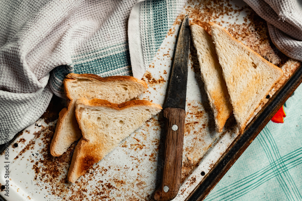 Triangular slices of toasted white bread with a soft texture inside and ...