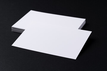 Poster - White blank business cards on dark black background