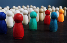 Diversity And Inclusion Concept. Crowd Of Wooden Figures And Color Figures.