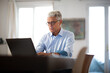 © mimagephotos - businessman working from home with laptop computer