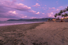 Dramatic Sunset In Sabang Beach, Baler Aurora. Low Angle View Of Outgoing Tide