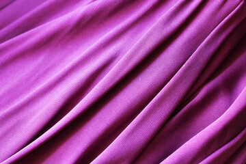 Pink satin fabric with pleats background