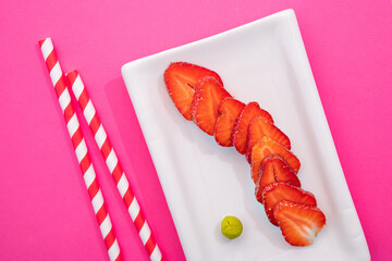 Wall Mural - Creative image of fresh strawberries in the form of sushi rolls