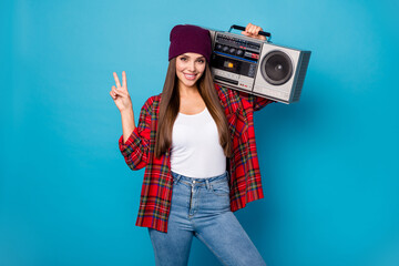 Canvas Print - Portrait of her she nice attractive pretty charming cute lovely cheerful cheery girl carrying boombox showing v-sign having fun isolated over bright vivid shine vibrant blue color background