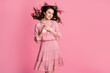 © deagreez - Photo of peaceful kind girl out hands chest look copyspace feel grateful hair wind blow wear dotted dress skirt isolated over pastel color background