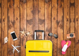 Wall Mural - Colored suitcase with traveler accessories on desk