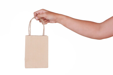 Wall Mural - Hand Holding Paper Bag isolated on White Background.