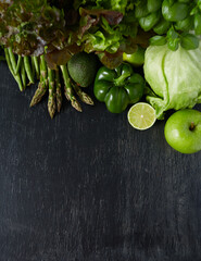 Wall Mural - green vegetables and herbs on black chalkboard